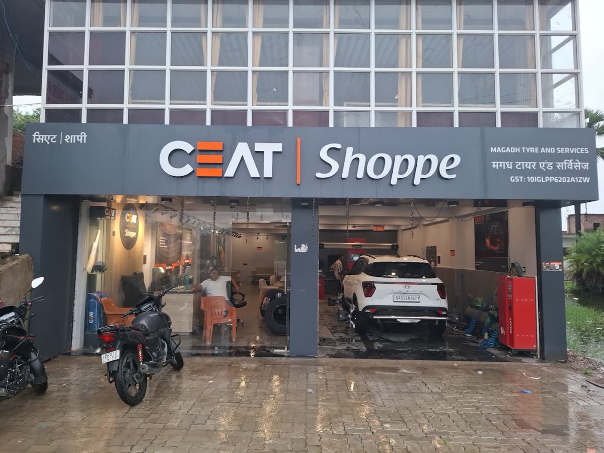 Magadh Tyre and Services CEAT Shoppe with a car in the service bay