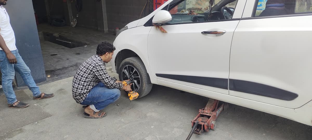 Mechanic removing a car wheel